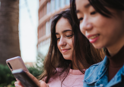 Two women looking at their phones